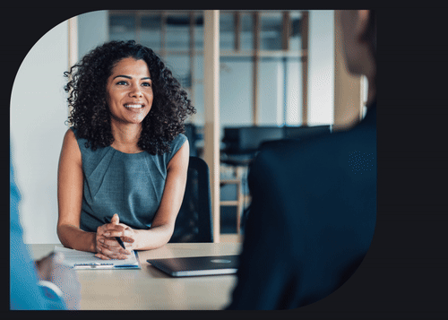 A legal professional smiles next to a checklist of Clio’s features for law firms.