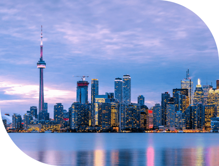 The Toronto skyline at dusk, featuring the CN Tower.