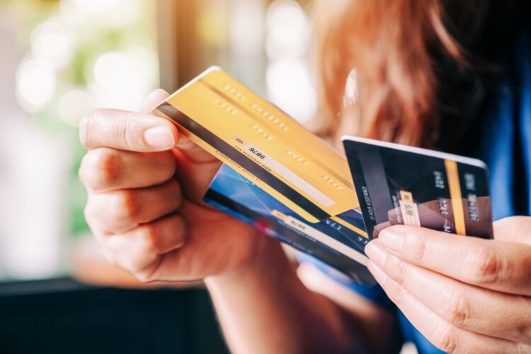 A women looks over which card to use to pay her law firm