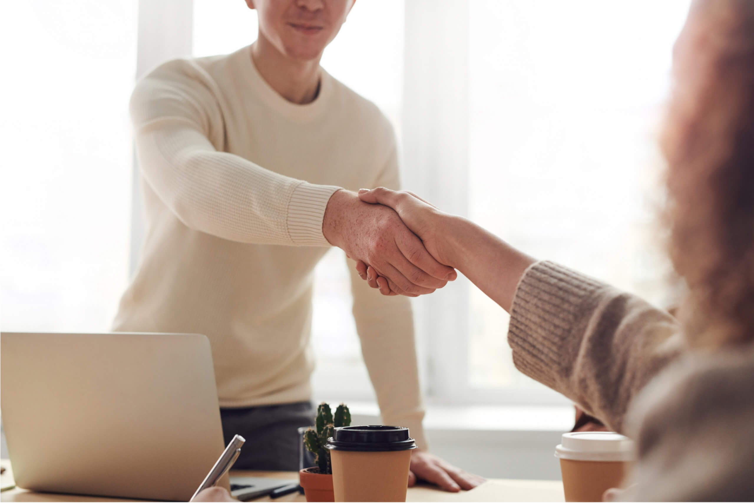 Two lawyers shaking hands