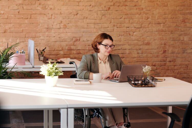 A photo of a lawyer on a laptop researching legal marketing companies.