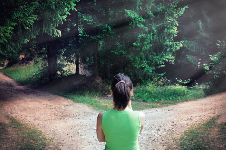 Woman with a choice near the forked road