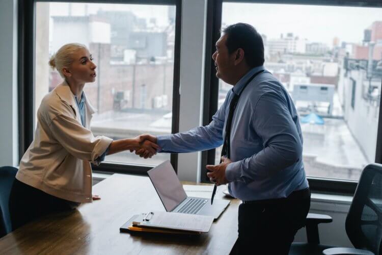 man and woman shaking hands