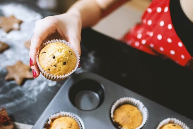 person enjoying muffins
