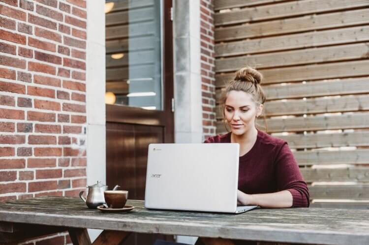 An environmental lawyer at work looking at her laptop