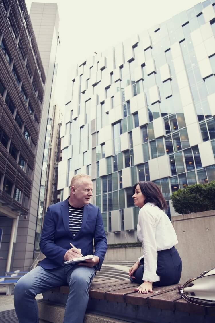 Lawyer meeting outside with client