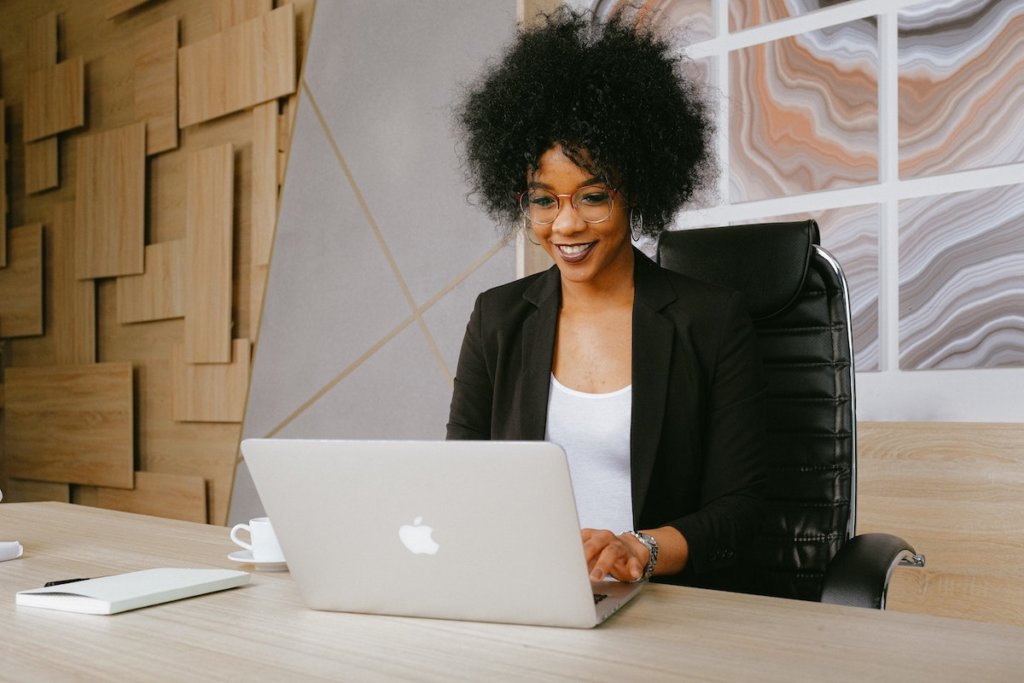 Person sitting at desk with laptop