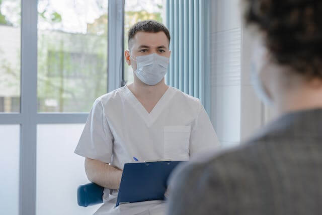 A doctor giving testimony.